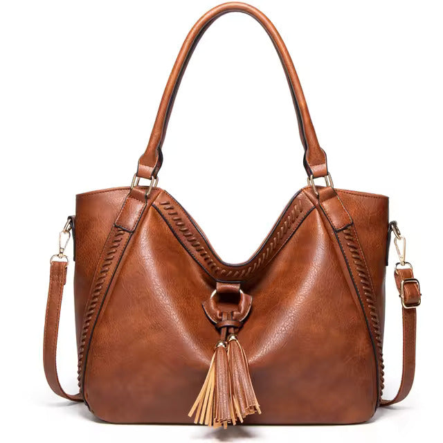 https://cdn.shopify.com/s/files/1/1057/5383/7908/files/Elise____Timeless_Leather_Bag_1.jpg?v=1785187547
