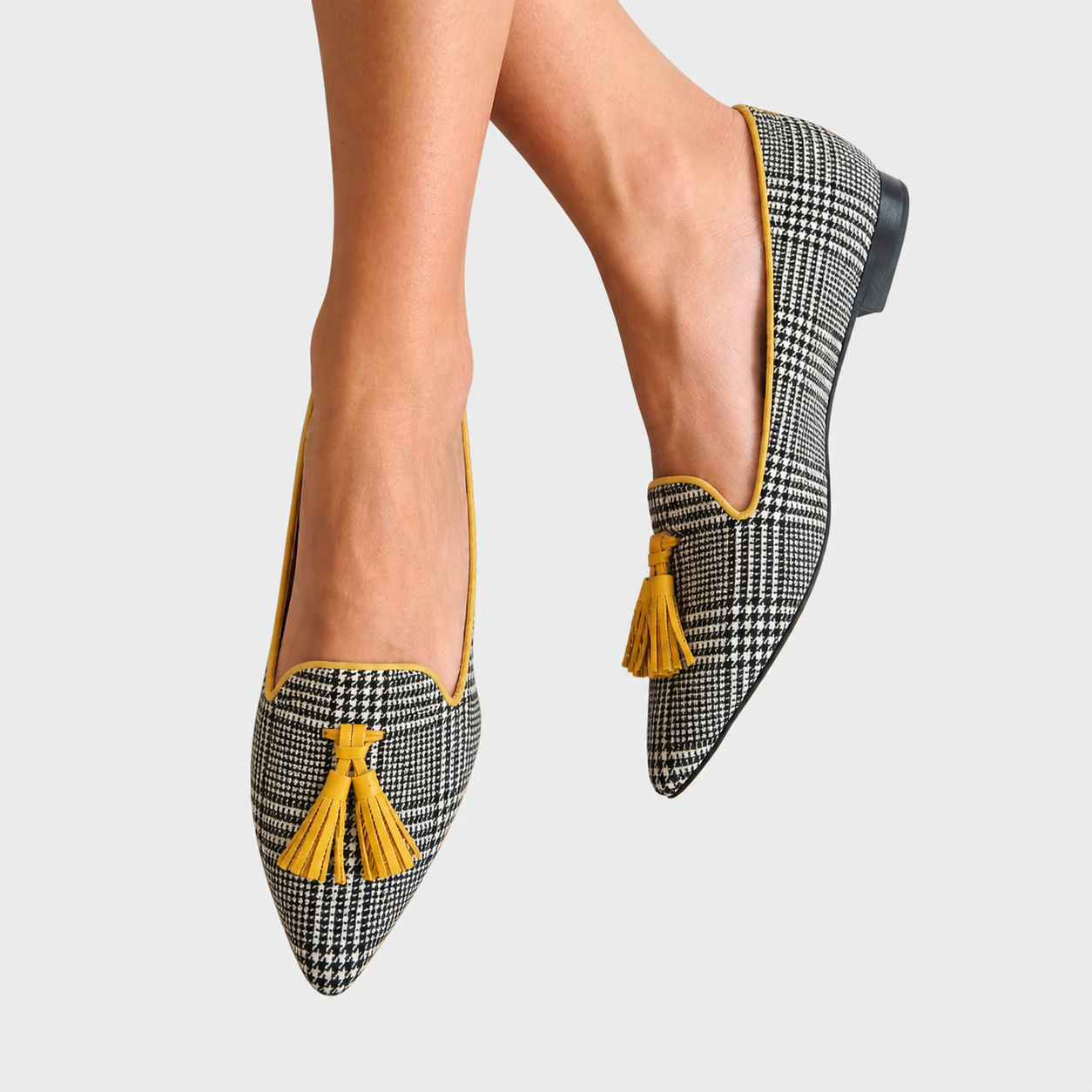 https://cdn.shopify.com/s/files/1/1037/6196/9489/files/Graceful_leg_pose_with_patterned_loafers.png?v=1780780543