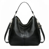 https://cdn.shopify.com/s/files/1/1057/5383/7908/files/Justine____Timeless_Leather_Bag_2.jpg?v=1785187531