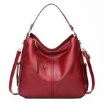 https://cdn.shopify.com/s/files/1/1057/5383/7908/files/Justine____Timeless_Leather_Bag_3.jpg?v=1785187531
