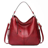 https://cdn.shopify.com/s/files/1/1057/5383/7908/files/Justine____Timeless_Leather_Bag_3.jpg?v=1785187531