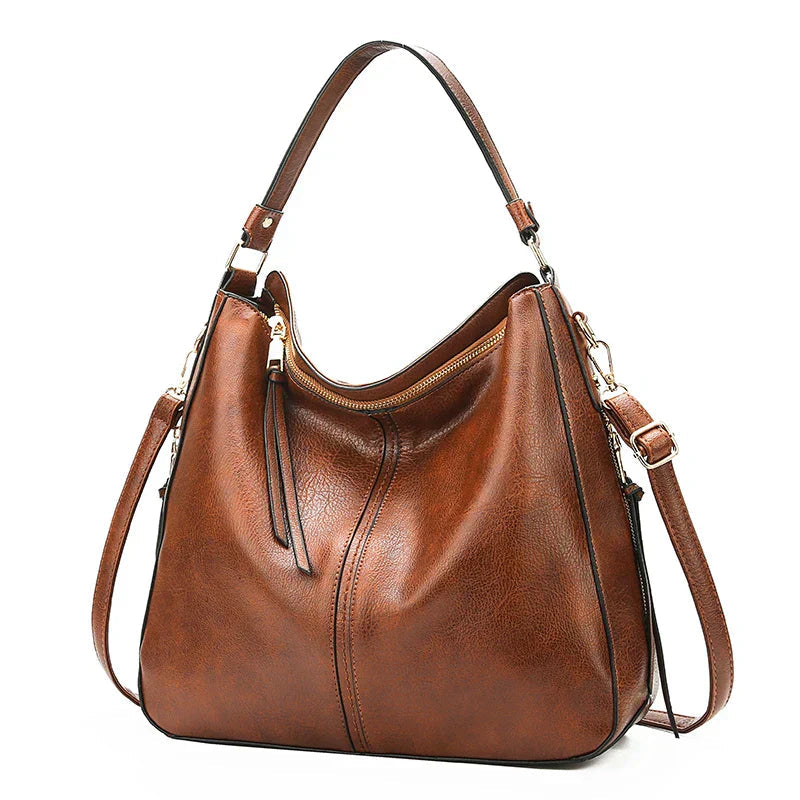 https://cdn.shopify.com/s/files/1/1057/5383/7908/files/Justine____Timeless_Leather_Bag_4.jpg?v=1785187531