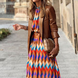 https://cdn.shopify.com/s/files/1/1057/5383/7908/files/Midi-jurk-met-gekleurde-print-3_9303ac13-ea84-4c6a-b8aa-6f308815270f.jpg?v=1785188006
