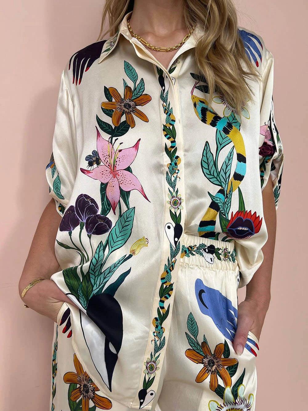 https://cdn.shopify.com/s/files/1/1037/6196/9489/files/Modern-Sophisticated-Feel-Satin-Unique-Print-Button-Down-Oversized-Blouse-_2.jpg?v=1780780329