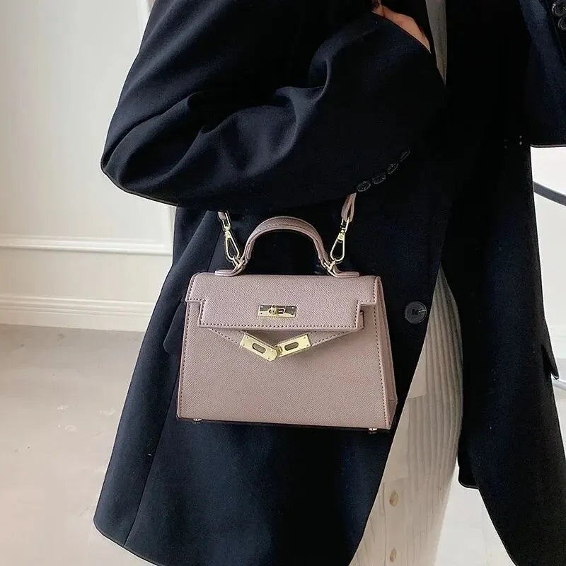 https://cdn.shopify.com/s/files/1/1037/6196/9489/files/Premium-Quality-Women-s-Handbag-2024-Spring-summer-New-Style-Trendy-Kara-Bag-Fashionable-Simple-Versatile_3bc18bb1-21c0-4146-89ee-cd10cf848cdf.webp?v=1783845576