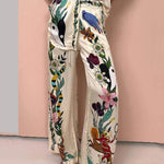 https://cdn.shopify.com/s/files/1/1037/6196/9489/files/Satin-Unique-Print-Elastic-Waist-Pocketed-Wide-Leg-Pants.jpg?v=1780780329