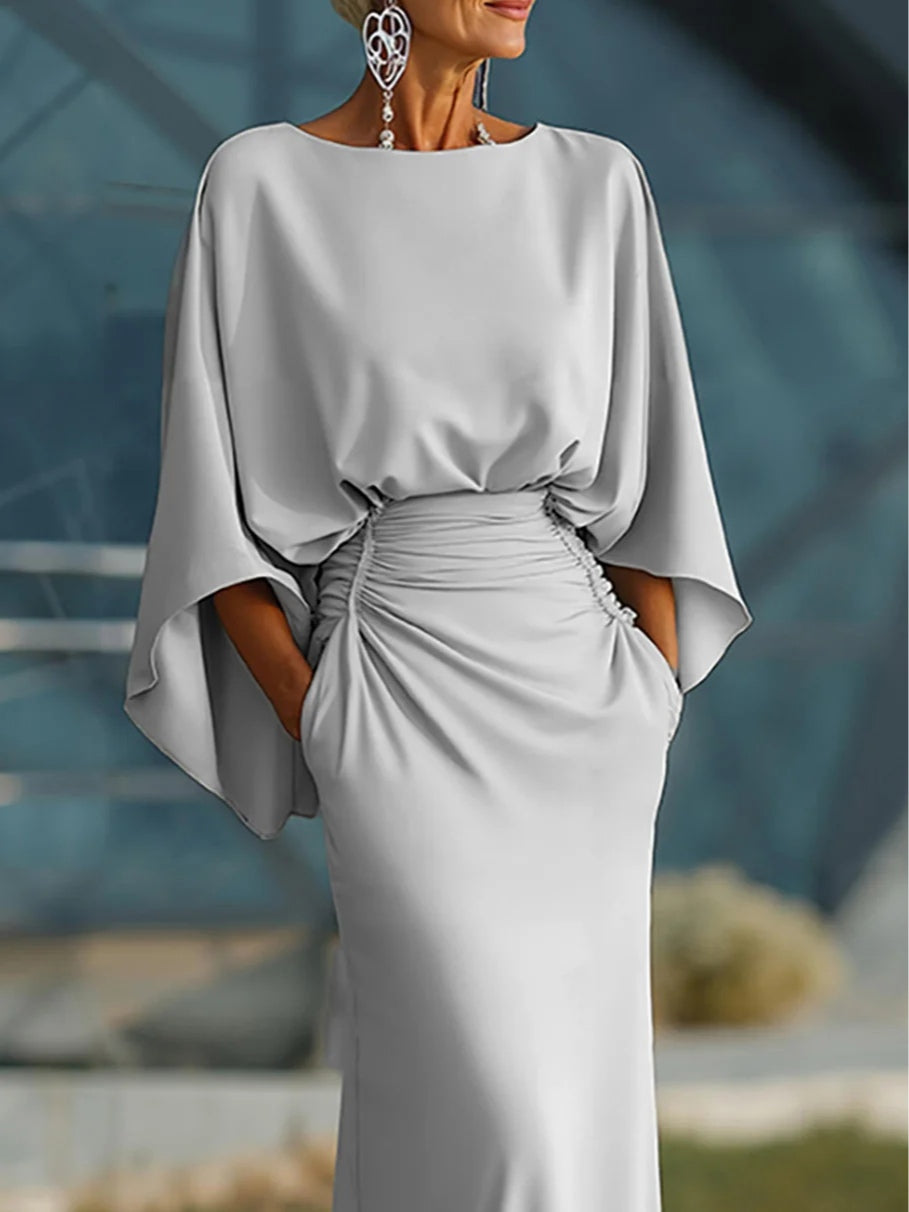 https://cdn.shopify.com/s/files/1/1037/6196/9489/files/SilverMermaidBoatNeckLongMotheroftheBrideDresswithPockets_1.jpg?v=1780780322