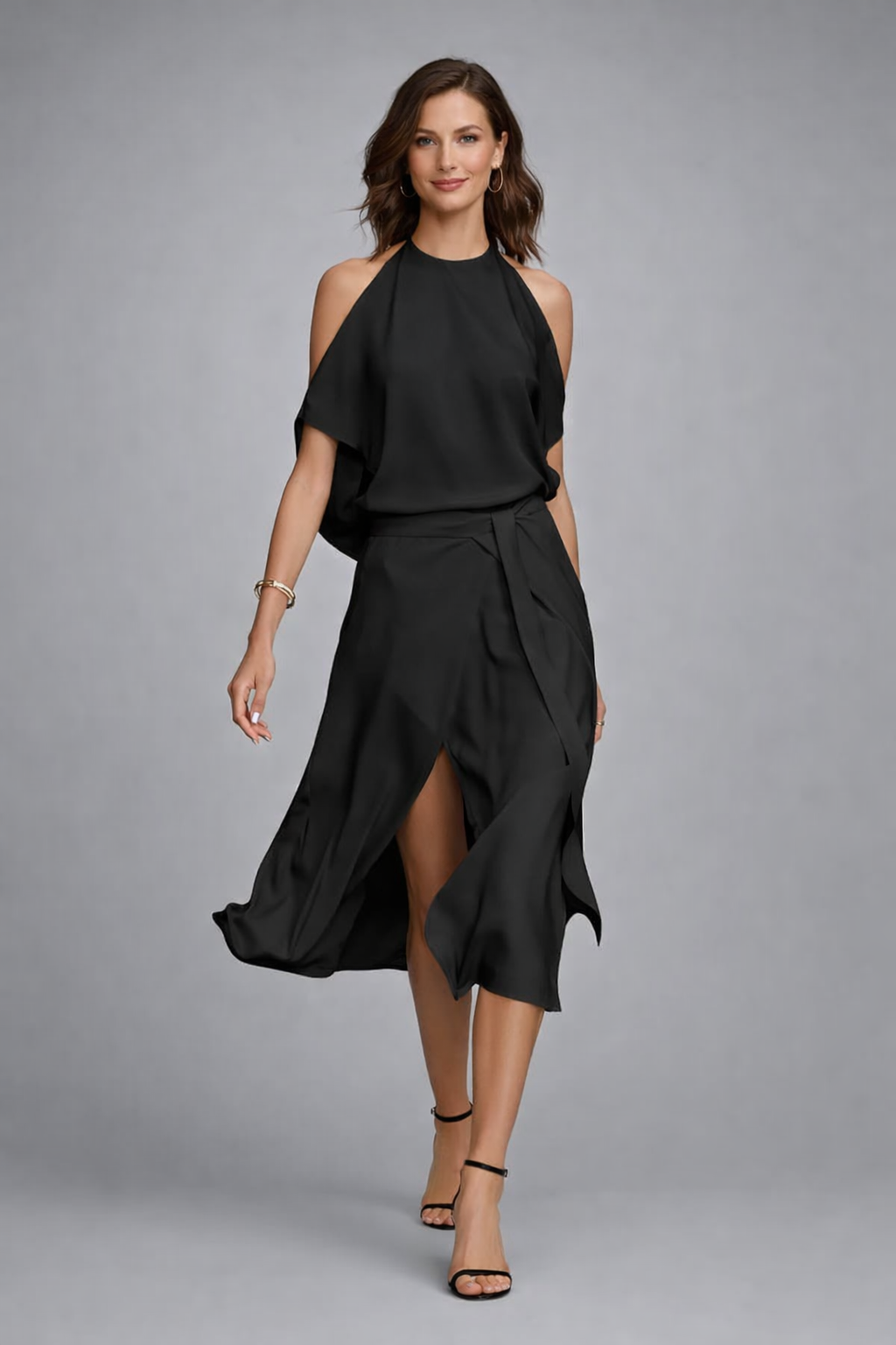https://cdn.shopify.com/s/files/1/1037/6196/9489/files/european-model-posed-studio-shot-black-halter-wrap-dress-cool-gray-background.png?v=1783845601