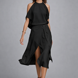 https://cdn.shopify.com/s/files/1/1037/6196/9489/files/european-model-posed-studio-shot-black-halter-wrap-dress-cool-gray-background.png?v=1783845601