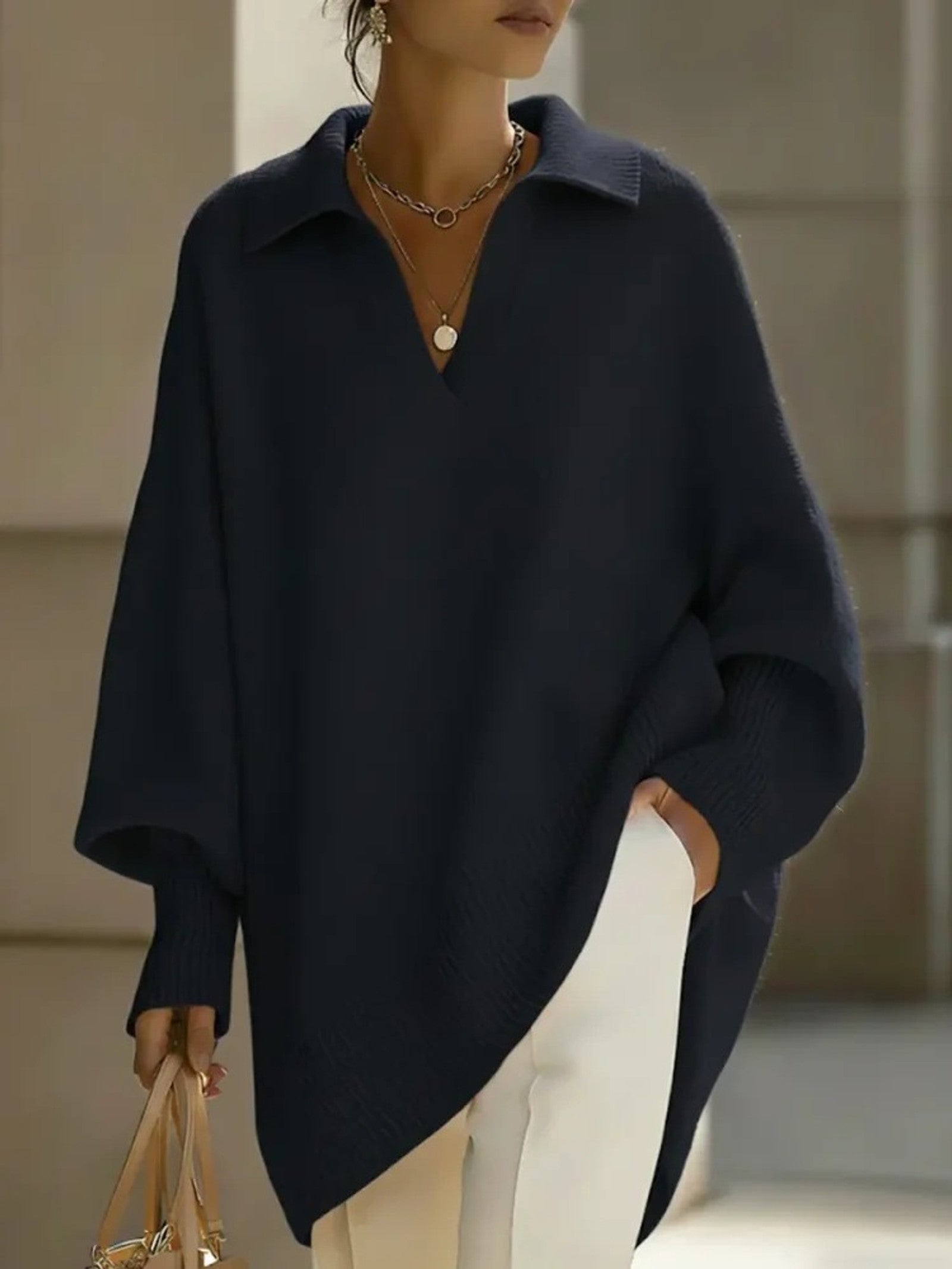 Maglione a V con maniche a pipistrello