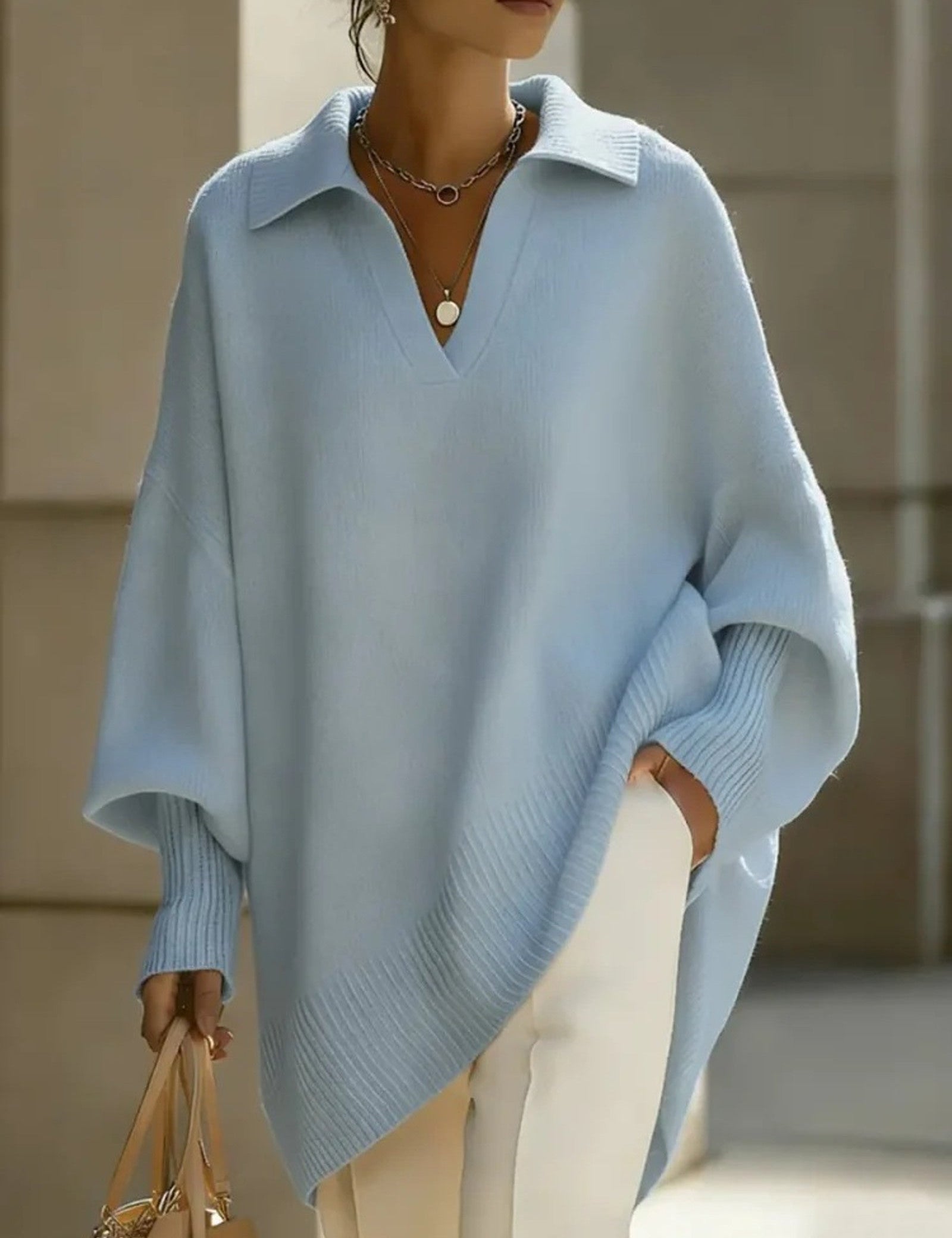 Maglione a V con maniche a pipistrello