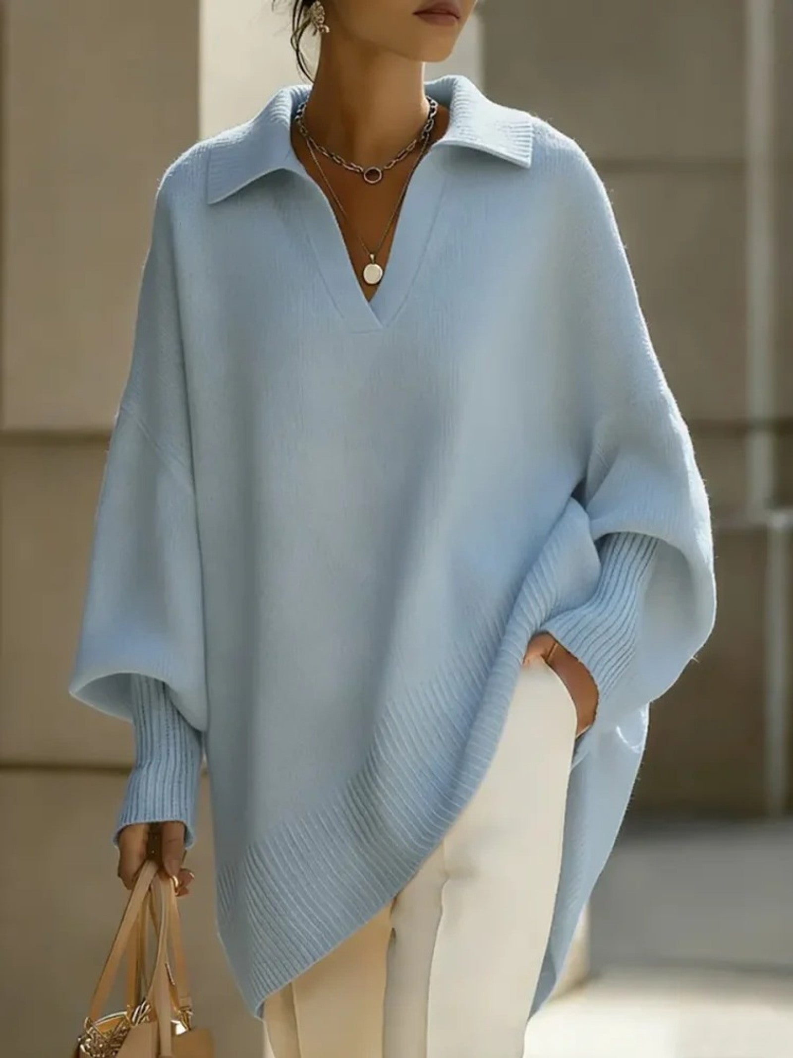 Maglione a V con maniche a pipistrello
