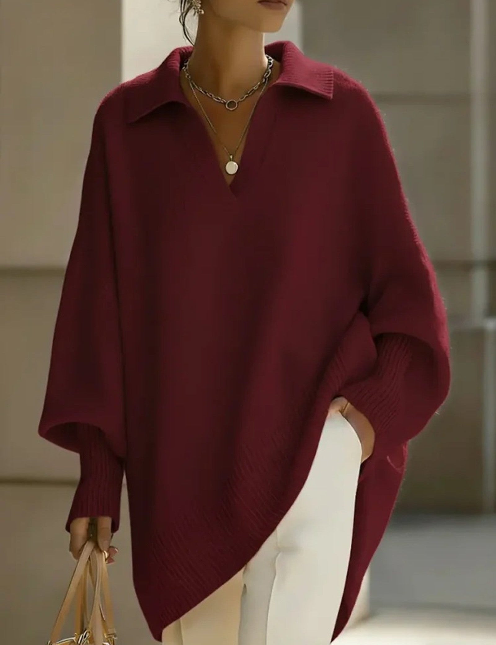 Maglione a V con maniche a pipistrello