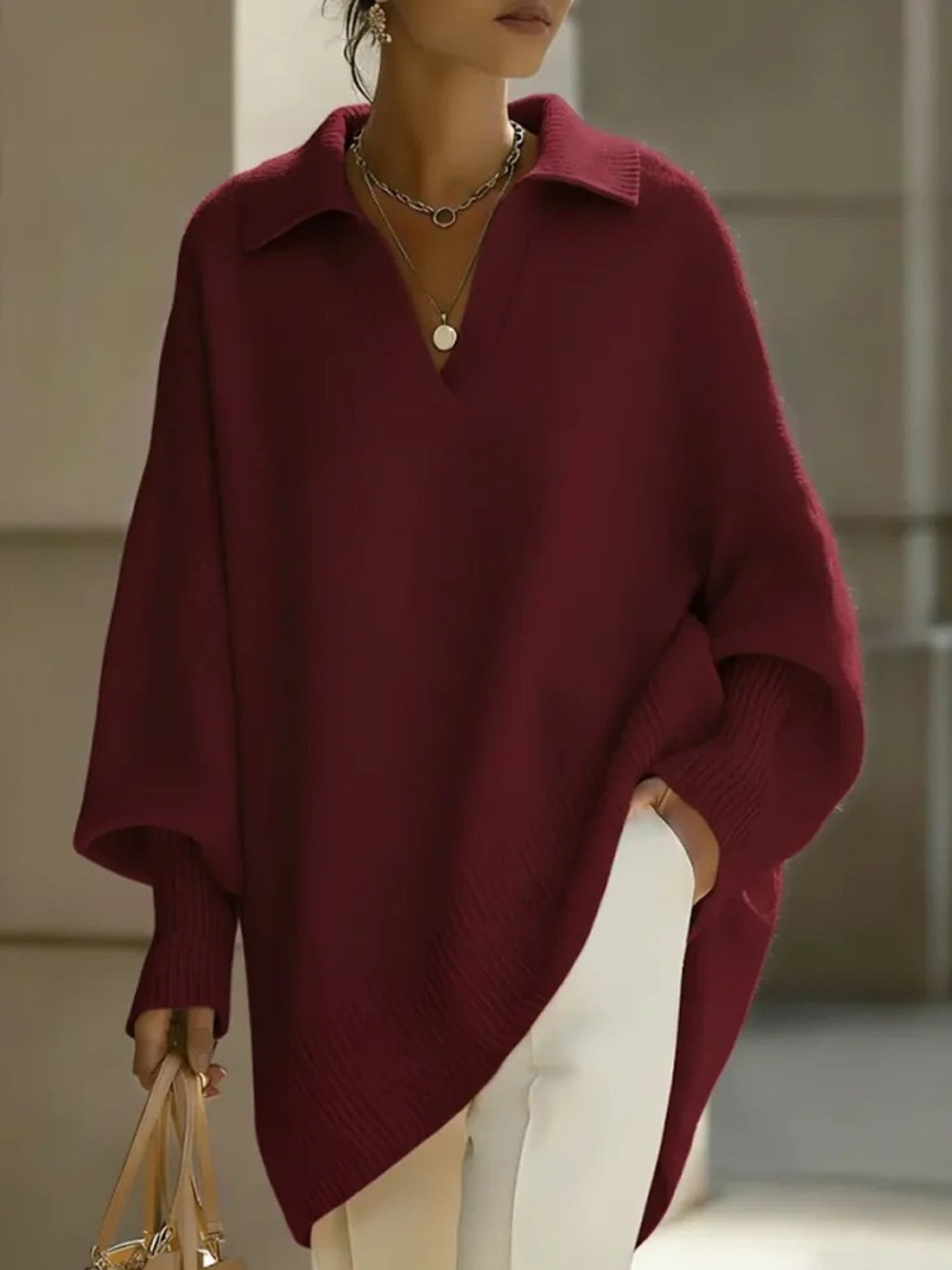 Maglione a V con maniche a pipistrello