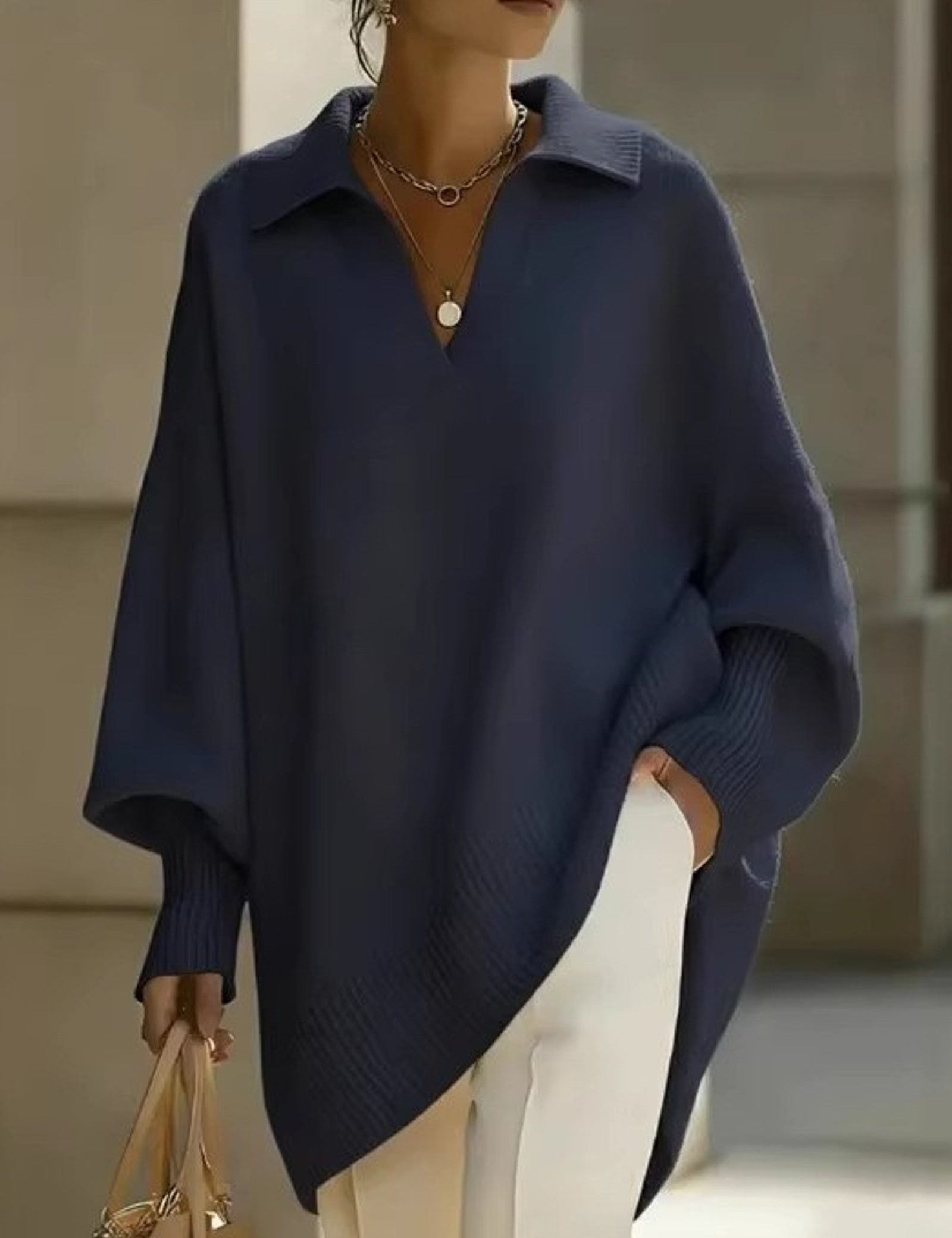 Maglione a V con maniche a pipistrello