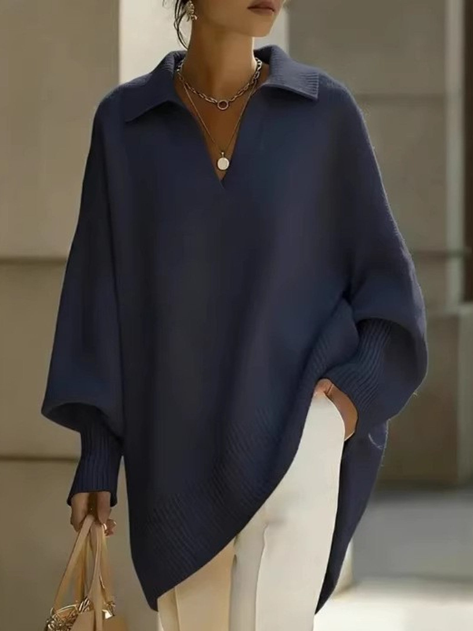 Maglione a V con maniche a pipistrello