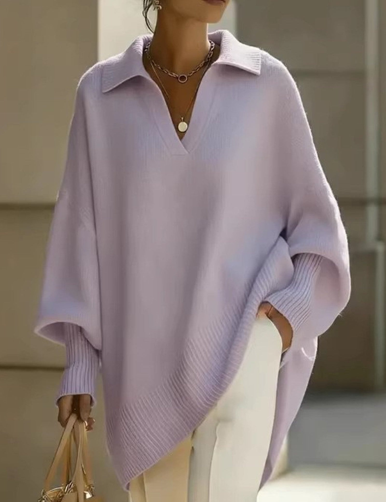 Maglione a V con maniche a pipistrello