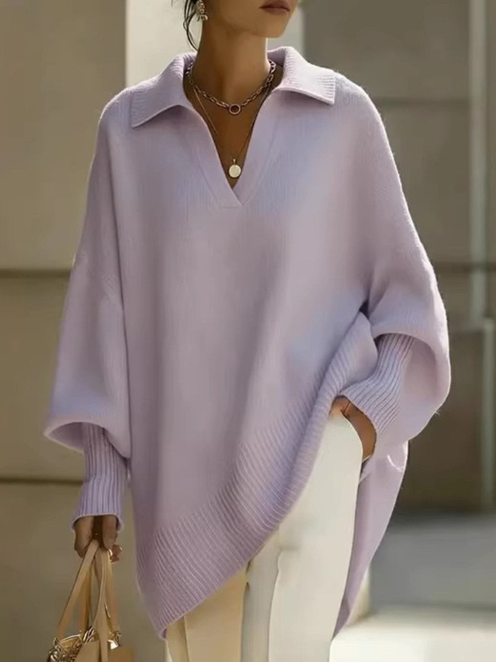 Maglione a V con maniche a pipistrello