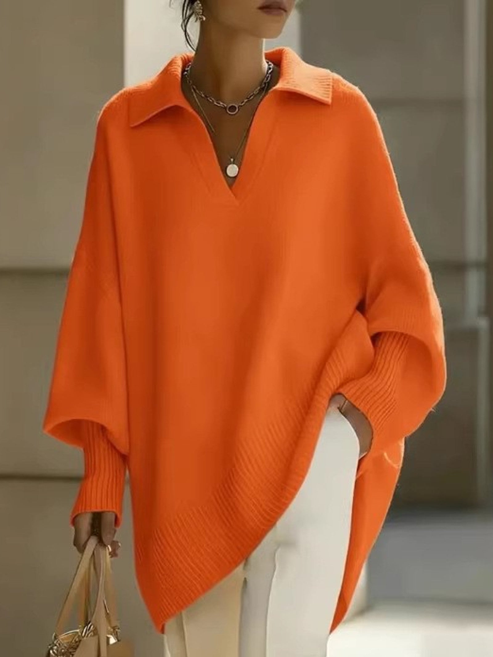 Maglione a V con maniche a pipistrello