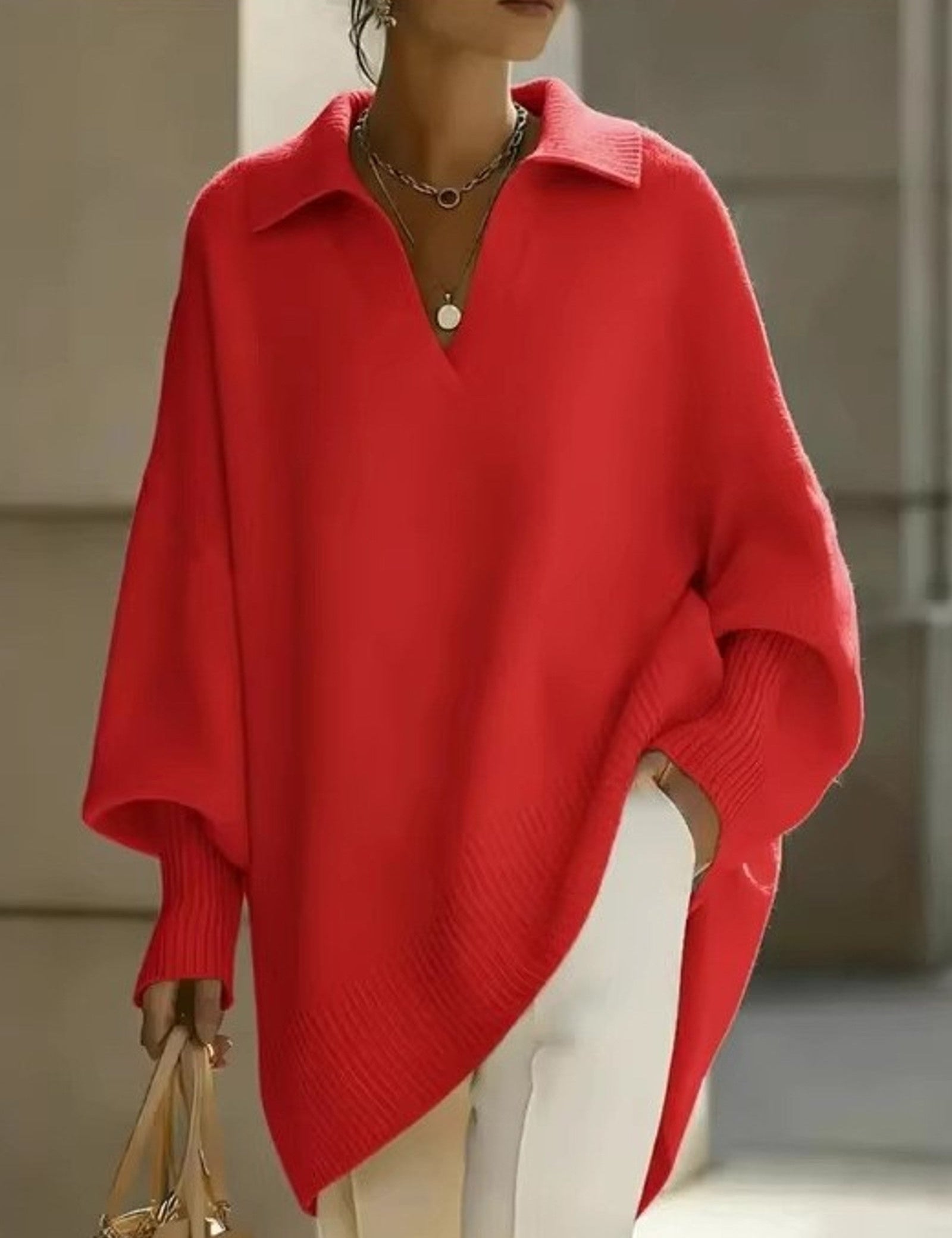 Maglione a V con maniche a pipistrello