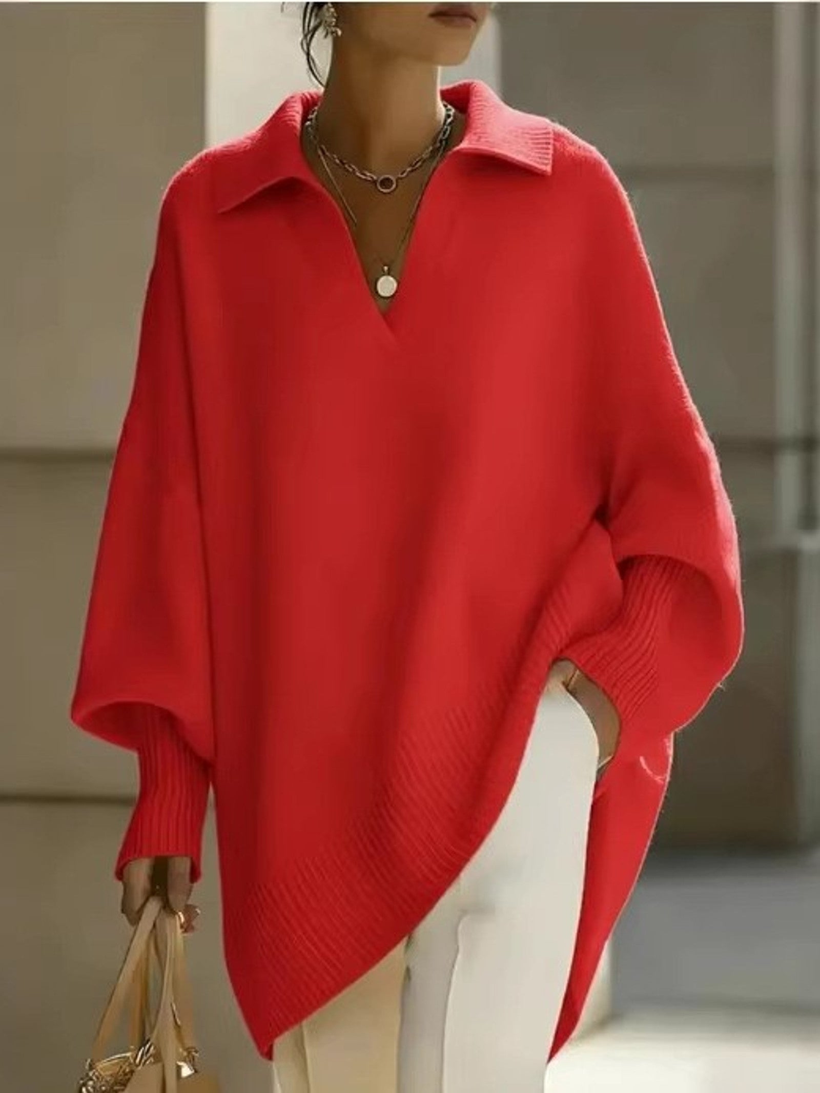 Maglione a V con maniche a pipistrello