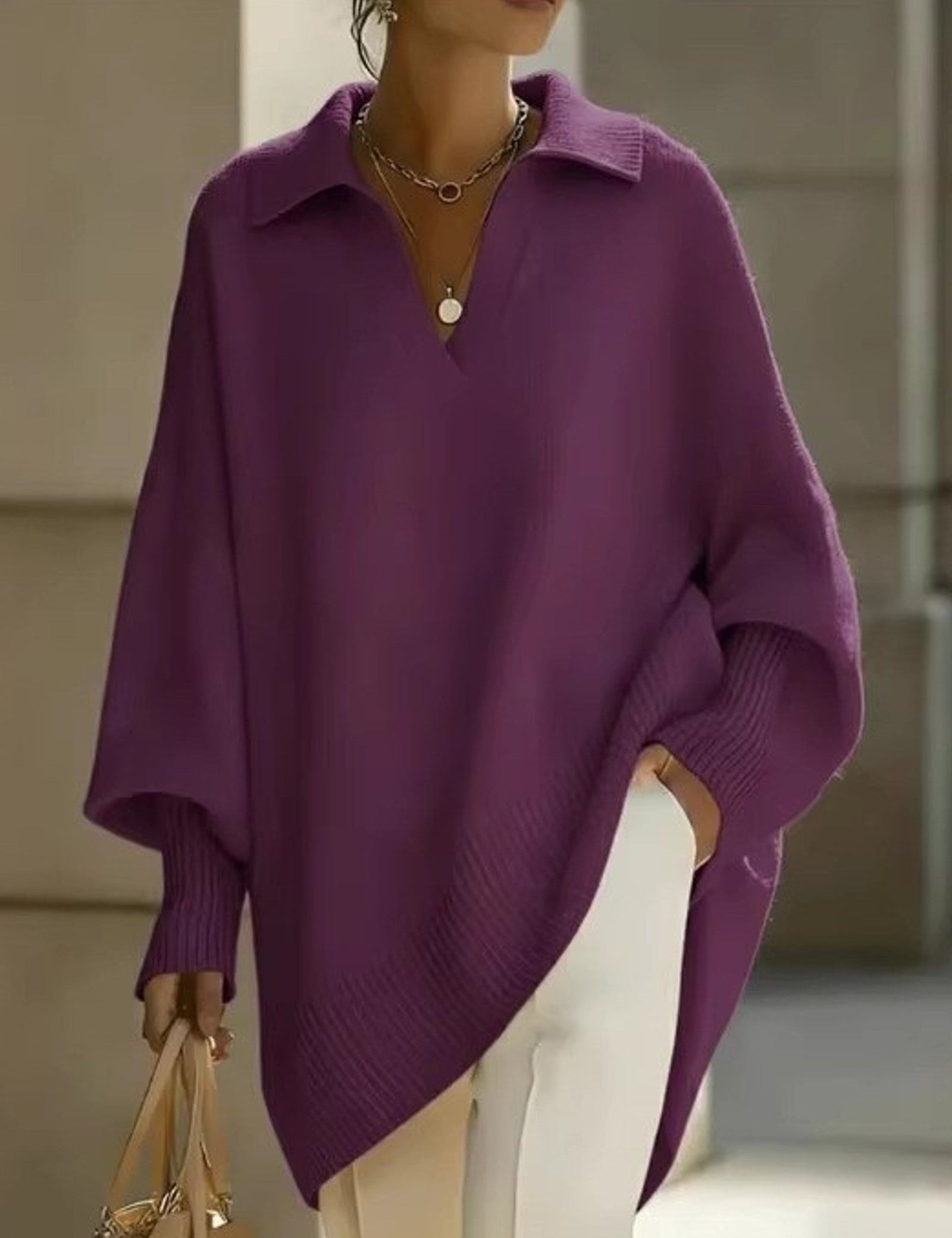 Maglione a V con maniche a pipistrello