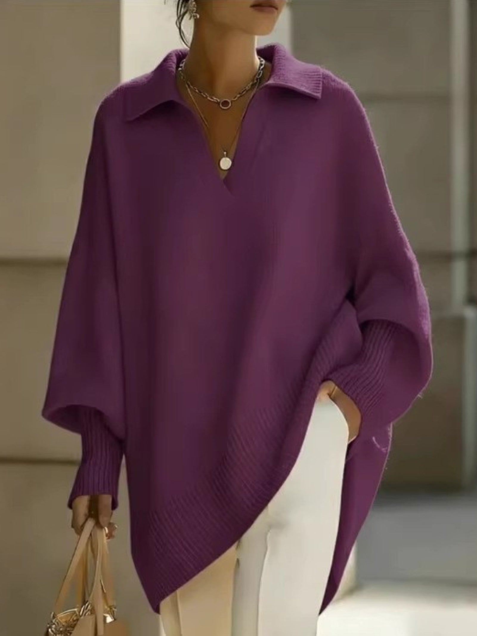 Maglione a V con maniche a pipistrello