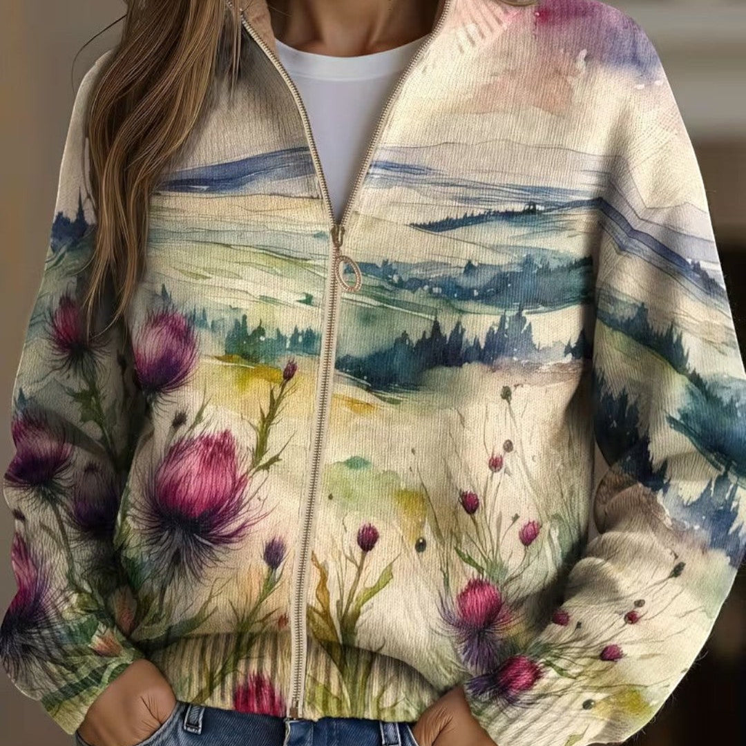 https://cdn.shopify.com/s/files/1/1057/5383/7908/files/modehaus-behrens-strickjacke-heike-landschaftsmotiv.jpg?v=1788891696