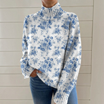 https://cdn.shopify.com/s/files/1/1057/5383/7908/files/mollie-may-blue-botanical-roll-neck-jumper.png?v=1789123526
