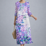 https://cdn.shopify.com/s/files/1/1037/6196/9489/files/polish-model-floral-midi-dress-cool-gray-studio-full-body-posed-shot.png?v=1781357877