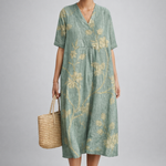 https://cdn.shopify.com/s/files/1/1037/6196/9489/files/polish-model-posed-studio-shot-sage-green-floral-linen-midi-dress-full-bod.png?v=1783845543
