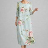 https://cdn.shopify.com/s/files/1/1037/6196/9489/files/polish-model-wearing-light-blue-floral-midi-dress-studio-full-body-shot.png?v=1781357877